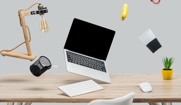 laptop-with-blank-screen-and-stationery-levitating-2023-11-27-05-06-08-utc